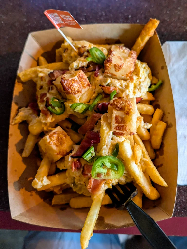 Duke's loaded fries with cheese sauce and toppings